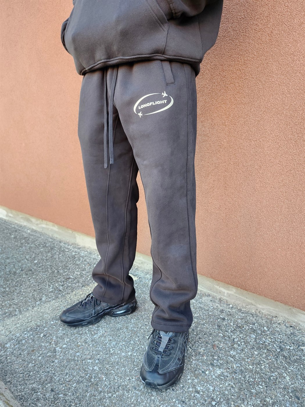 Model wearing the FlightMode Sweatpants in black, full length