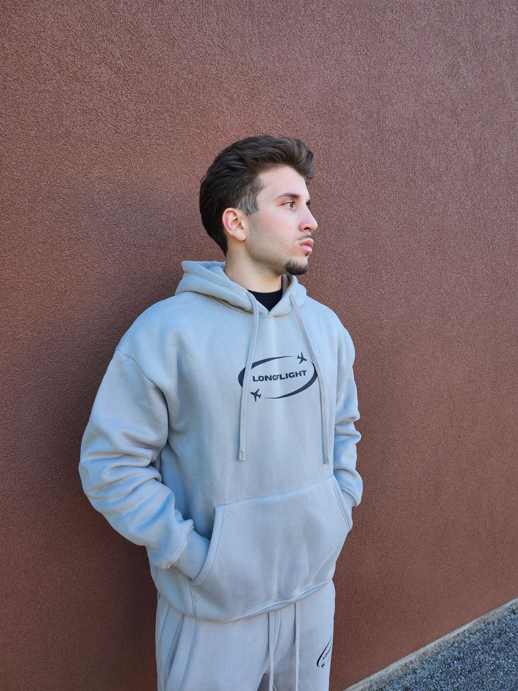 Model wearing the FlightMode Set in grey, hoodie and matching sweatpants