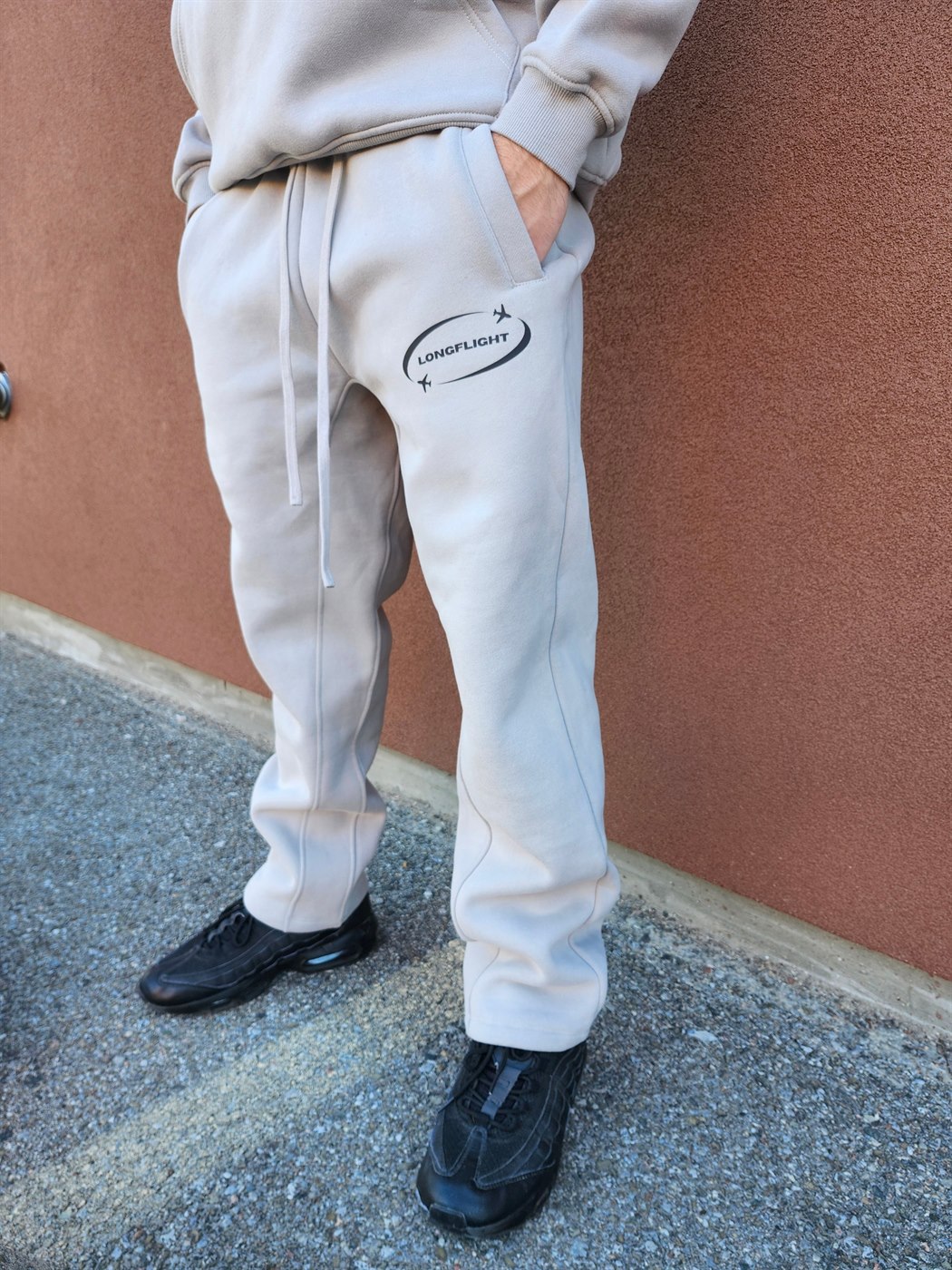 Model wearing the FlightMode Set in grey, sweatpants and logo detail